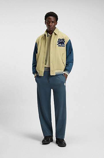 Verryttelyhousut BOSS HUGO x RB Oversized-Fit Tracksuit Bottoms with Striped Waistband and Drawstring Tummansininen | 50549308, 1