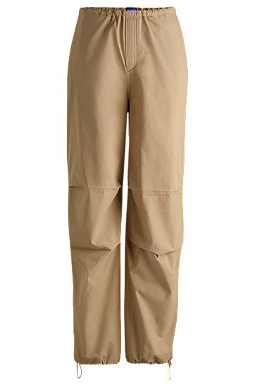 Cargo housut BOSS Baggy Parachute Cotton Canvas Trousers Beige | 50527950