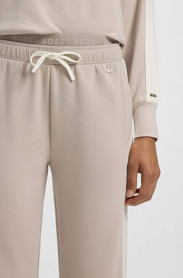 Verryttelypuku BOSS Contrast-trim tracksuit bottoms with double waistband Beige | 50550717, 1