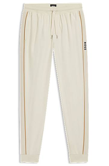 Verryttelyhousut BOSS Cotton-terry tracksuit bottoms with side tape and vertical logo Beige | 50550613