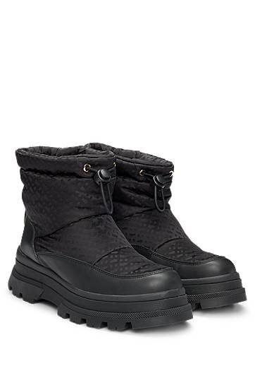 Tennarit ja kengät BOSS Monogram Slim-Fit Boots with Leather Trims Musta | 50523505