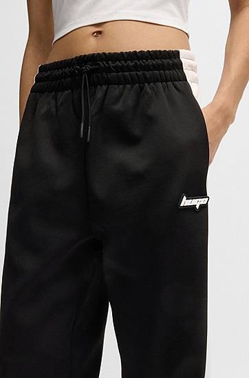 Verryttelyhousut BOSS Retro Tracksuit Bottoms with Side Stripe Musta | 50537080, 1