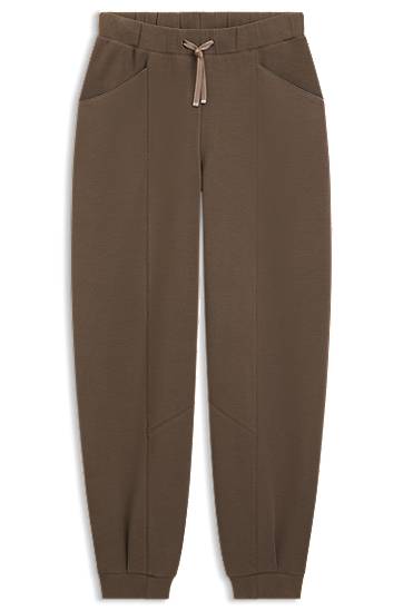 Verryttelypuku BOSS Relaxed-fit tracksuit bottoms with lustrous piping Ruskea | 50548633