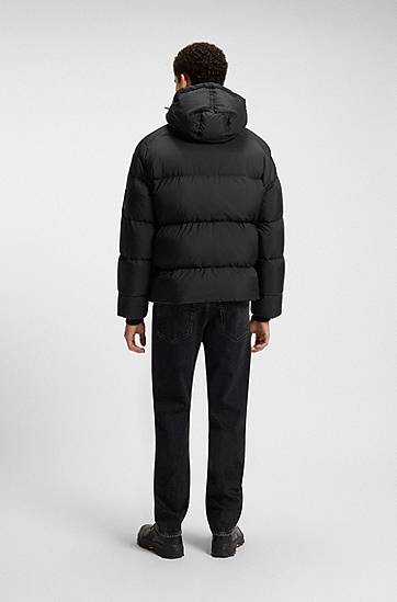 Puffer takki BOSS Oversized-fit Hooded Puffer Jacket in Crinkle Ripstop Musta | 50543618, 1