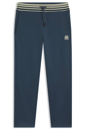 Verryttelyhousut BOSS HUGO x RB Oversized-Fit Tracksuit Bottoms with Striped Waistband and Drawstring Tummansininen | 50549308